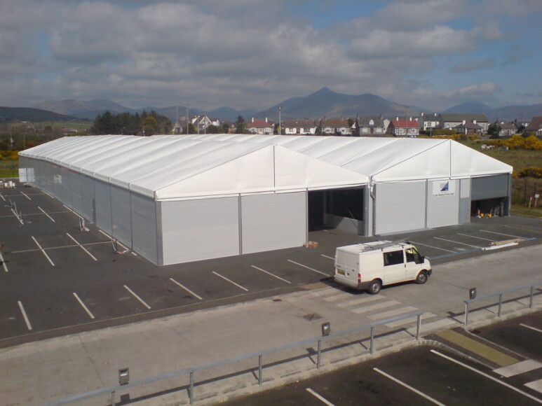 Grey-temporary-building-with-insulated-warehouse-roof