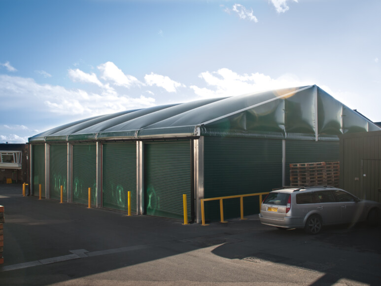 aganto-temporary-storage-facility-with-green-colour-cladding