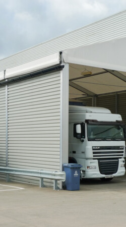 white-truck-parked-in-aganto-temporary-canopy-for-loading
