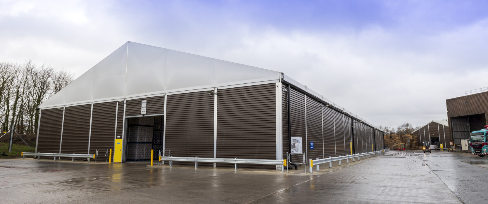 temporary structure with PVC gables and gutters to protect against weather damage