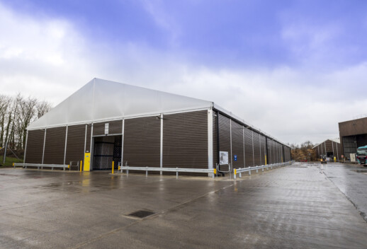 temporary structure with PVC gables and gutters to protect against weather damage