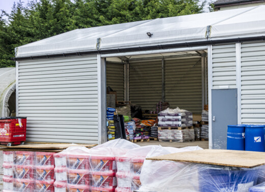single-skin temporary structure with side mounted roller shutter door
